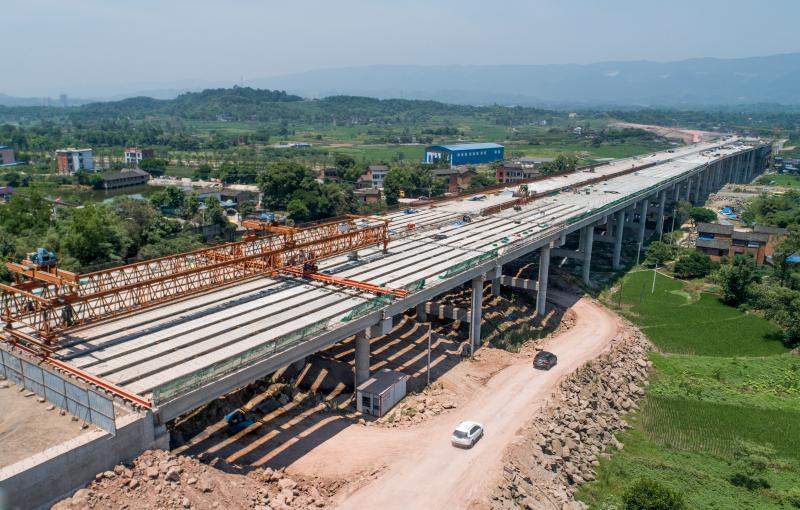 Компания «Beixin Road & Bridge Group» завершила монтаж пролетных строений моста по проекту расширения пропускной способности скоростных магистралей г. Чунцин.